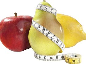 Apfel, Birne und Zitrone mit Massband