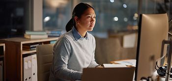 Asian businesswoman, laptop and office at night for working, proj