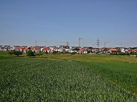 Bauland Wohnungsbau Grünfläche Kräne