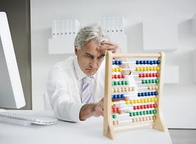 Businessman using an abacus