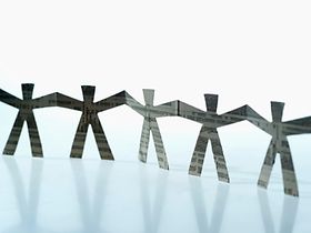 Close-up of paper chain figures