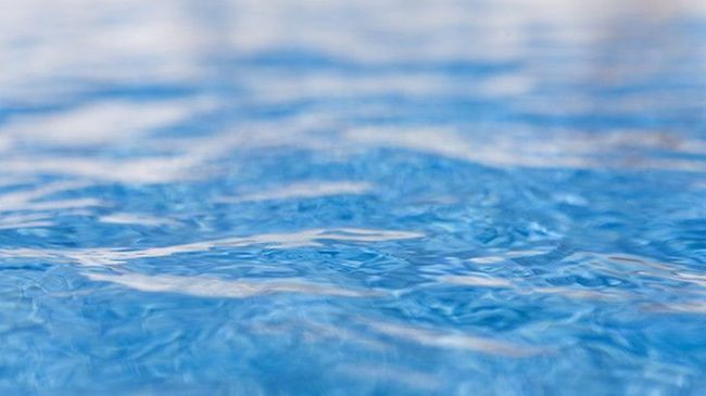 Close up of shimmering water in swimming pool