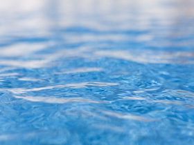 Close up of shimmering water in swimming pool