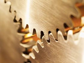 Close-up of three cogs