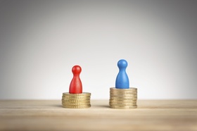 Wage gap concept with blue figure symbolizing men and red pawn women