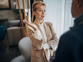 Father and daughter successful businessman and businesswoman talking about work