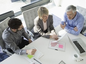 Business people in meeting discussing new strategies