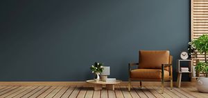 Dark blue living room interior with cozy leather armchair