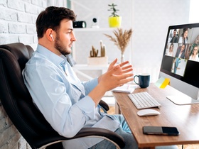 Zoom conference. Business partners communicate via video using laptop. The guy talks with his busine