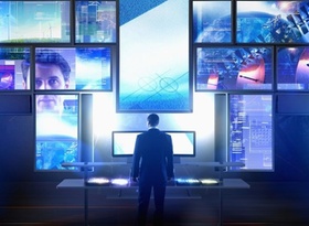 Mann steht vor vielen Bildschirmen, Digitalisierung