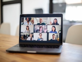 Group of business people seen on a laptop screen having an online meeting. Colleagues having a work