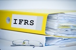 ifrs standards folder with accounting documents and financial reports