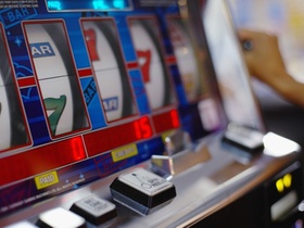 Person Playing Slot Machine