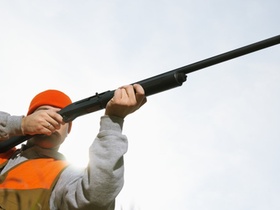 Hunter Aiming Shotgun