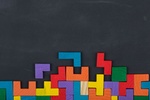 Business creative solution concept - jigsaw on the blackboard