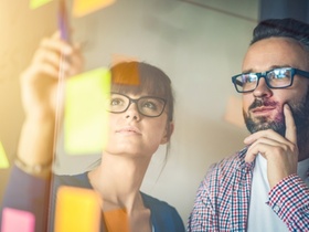 Business people meeting at office and use post it notes to share idea. Brainstorming concept. Sticky