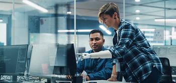 Teamwork In Office: Woman with Disability Prosthetic arm